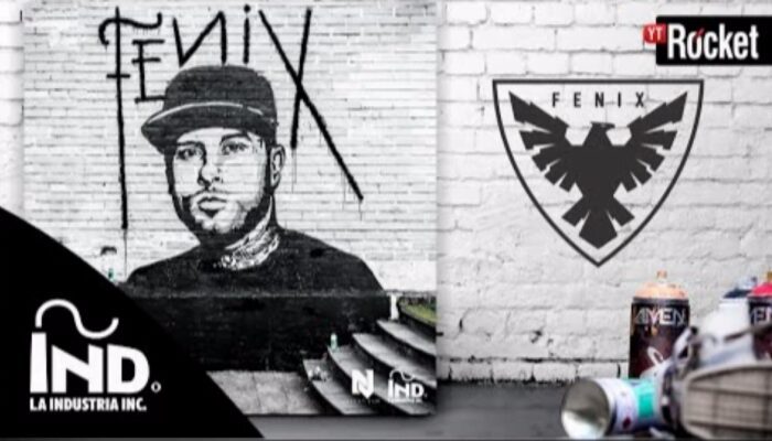 Graffiti mural of man beside phoenix emblem