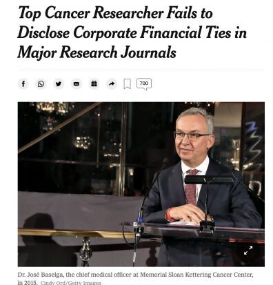 Man in suit speaking at podium with headline