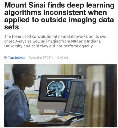 Clinician viewing brain MRI scans on monitors