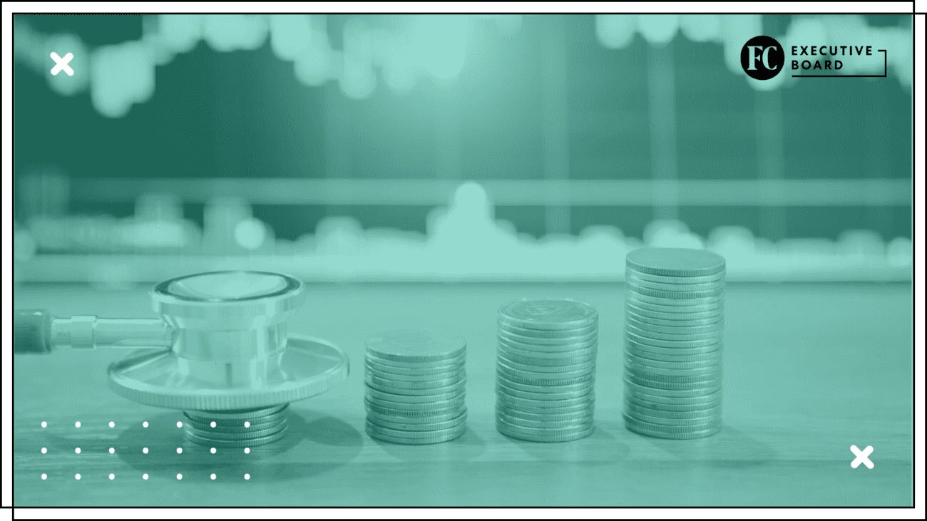 Stethoscope beside ascending stacks of coins