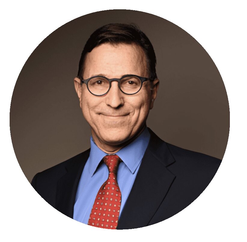 Professional headshot: man in suit and glasses